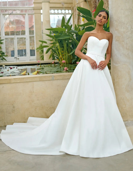 a simple wedding dress with bow